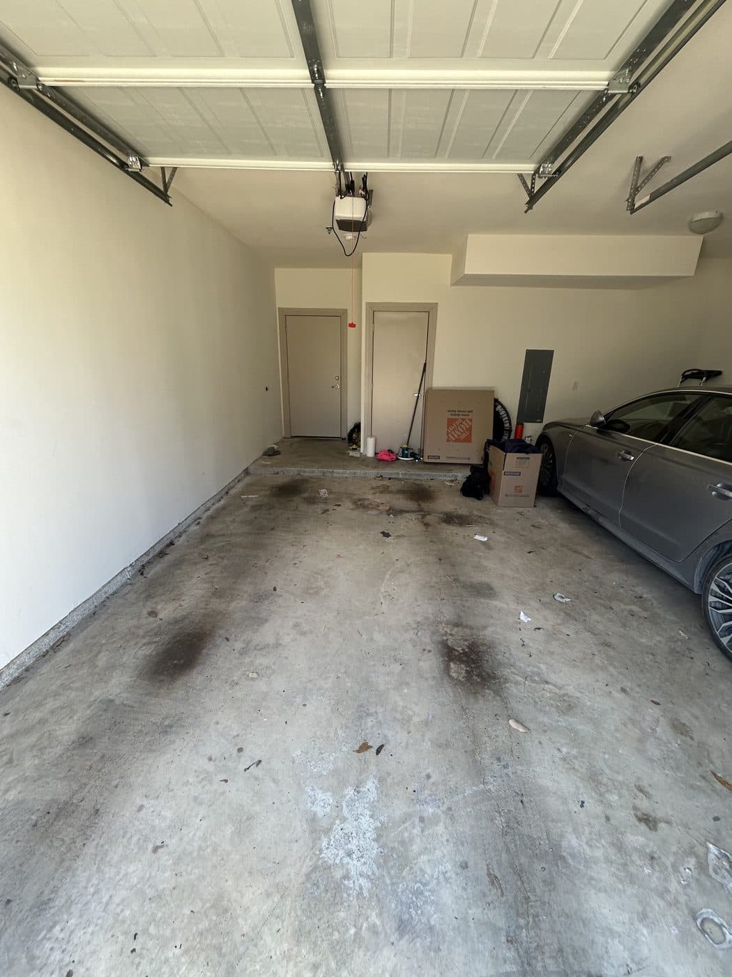Same garage empty and swept clean after removal